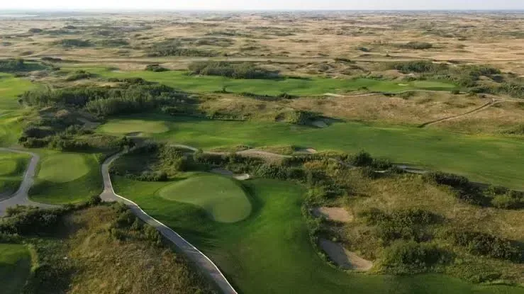 Aerial view of open prairie and golf course near Dakota Dunes Resort, Whitecap